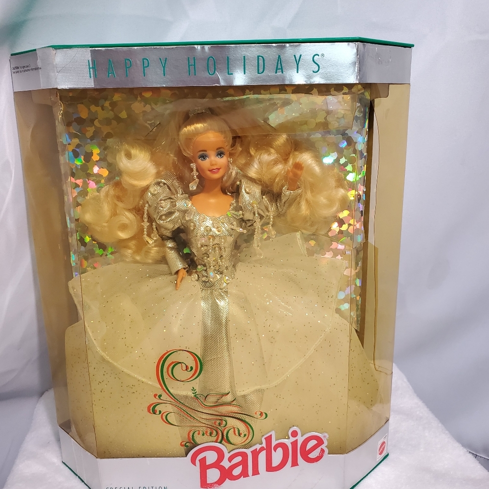 Holiday Barbie her box was around for a long time so it is not in good condition